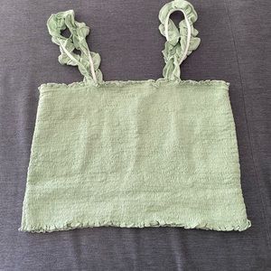 Frilly green top